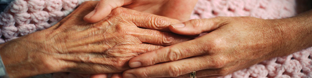 Holding Hands with Elderly Patient